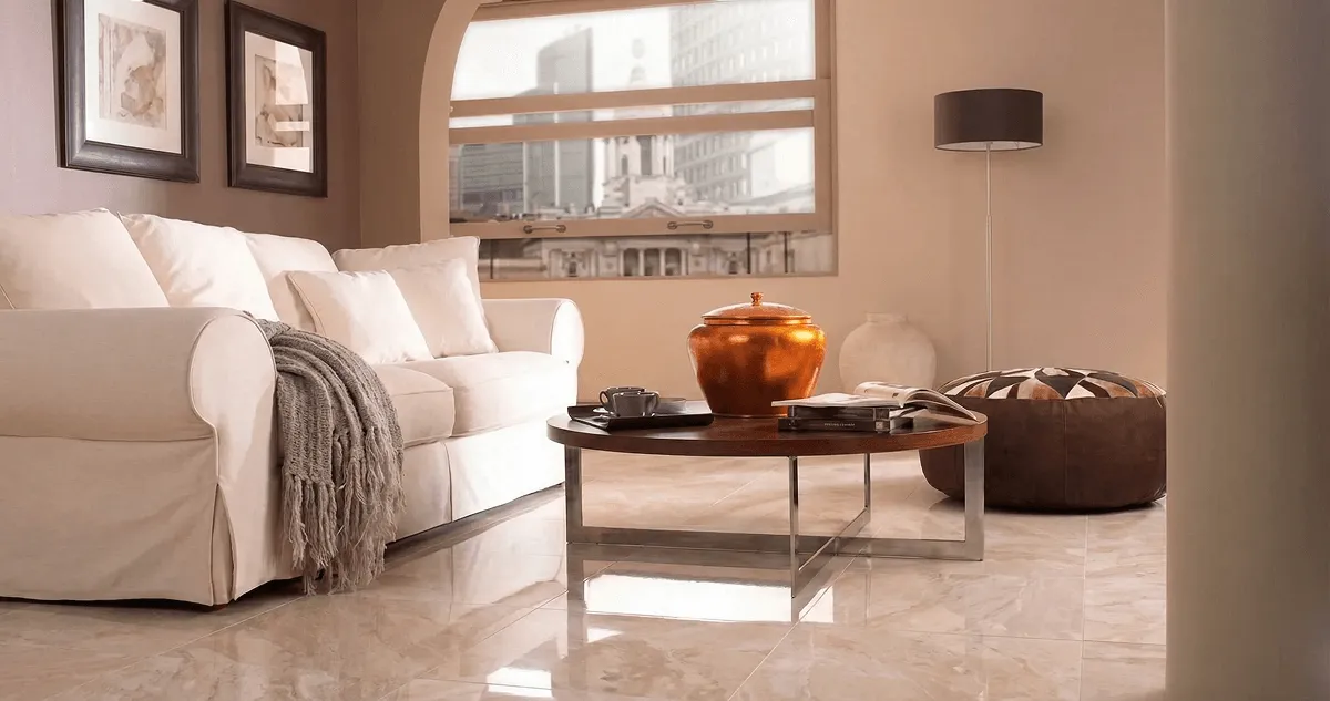 Modern living room with professionally installed marble flooring, a beige sofa, coffee table in Rockford, IL